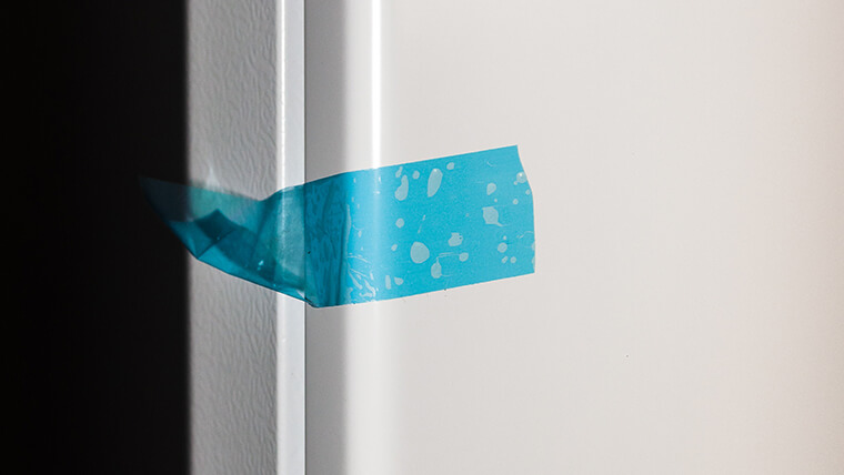 sticky tape holding a fridge
